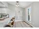Eat-in kitchen features bright light, hardwood floors, a modern chandelier, and seating at 19644 E Girard Dr, Aurora, CO 80013