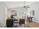 Bright open-concept living and dining area with wood floors, ceiling fan and modern furniture at 19644 E Girard Dr, Aurora, CO 80013