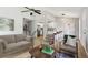 Open-concept living room featuring hardwood floors and easy access to the kitchen at 19644 E Girard Dr, Aurora, CO 80013