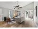 Comfortable living room with hardwood floors, neutral tones and sliding door to outdoor deck at 19644 E Girard Dr, Aurora, CO 80013