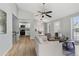 Inviting living room with vaulted ceiling, hardwood floors and views of the kitchen and dining area at 19644 E Girard Dr, Aurora, CO 80013