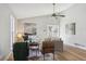 Bright and airy living room with vaulted ceilings, stylish furnishings, and wood-look flooring at 19644 E Girard Dr, Aurora, CO 80013