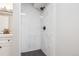 Tiled walk-in shower has sleek black fixtures and offers a modern, luxurious experience at 19644 E Girard Dr, Aurora, CO 80013