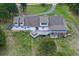 Aerial view of the home highlighting the back deck, hot tub and well-manicured lawn at 3619 Estates Cir, Larkspur, CO 80118