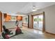 Inviting basement area with a kitchenette, natural light and french doors leading outdoors at 3619 Estates Cir, Larkspur, CO 80118