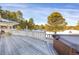Exterior view of a deck overlooking a snowy wooded landscape, perfect for relaxing at 3619 Estates Cir, Larkspur, CO 80118