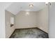Bright, minimalist room with sloped ceiling at 3619 Estates Cir, Larkspur, CO 80118