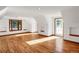 Bright room featuring hardwood floors and a door to the outside at 3619 Estates Cir, Larkspur, CO 80118
