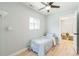 Bedroom features hardwood floors, fan, a large window overlooking the backyard and next to the bathroom at 710 Raleigh St, Denver, CO 80204