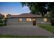 Charming single-story home with red roof and a well-manicured front yard at 710 Raleigh St, Denver, CO 80204