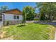 A well-manicured front yard and a charming single-story house with a gravel driveway at 710 Raleigh St, Denver, CO 80204