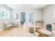 Bright living room featuring hardwood floors, neutral tones, and access to bedrooms at 710 Raleigh St, Denver, CO 80204