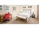 Well-lit bedroom with a bed, desk, and decorative artwork at 4031 S Hudson Way, Cherry Hills Village, CO 80113