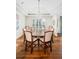 Elegant dining room with hardwood floors, tray ceilings, and large dining table at 4031 S Hudson Way, Cherry Hills Village, CO 80113