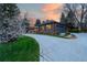 Stunning brick home with attached garage and elegant driveway at sunset at 4031 S Hudson Way, Cherry Hills Village, CO 80113