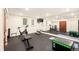 Spacious home gym with exercise equipment, mirrors, and rubber flooring at 4031 S Hudson Way, Cherry Hills Village, CO 80113