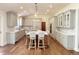 Bright kitchen with grey cabinets, marble countertops, and a large island at 4031 S Hudson Way, Cherry Hills Village, CO 80113