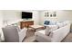 Comfortable living room with plush seating, a TV, and a decorative coffee table at 4031 S Hudson Way, Cherry Hills Village, CO 80113