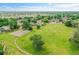 Aerial view of a lush green park surrounded by a charming neighborhood with walking paths and trees at 12651 Elm St, Thornton, CO 80241
