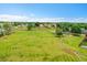 Aerial view of a well-kept park featuring a playground and basketball court in a residential neighborhood at 12651 Elm St, Thornton, CO 80241