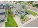 Aerial view of a well-maintained home with solar panels and a spacious driveway in a suburban neighborhood at 12651 Elm St, Thornton, CO 80241