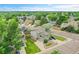 An aerial view displays a charming two-story house, showcasing its location in a tree filled neighborhood at 12651 Elm St, Thornton, CO 80241