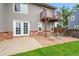 Charming backyard with a patio, balcony, and well-maintained lawn at 12651 Elm St, Thornton, CO 80241