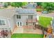 This home's backyard shows a lawn, patio, seating, landscaping, and an upper porch that looks over the yard at 12651 Elm St, Thornton, CO 80241