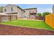 Well-kept backyard featuring a lush lawn, patio, and wood fence at 12651 Elm St, Thornton, CO 80241