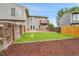 The backyard has a lush lawn, patio and privacy fence at 12651 Elm St, Thornton, CO 80241