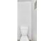 A simple and clean bathroom features a white toilet with a white wall at 12651 Elm St, Thornton, CO 80241