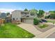 Well maintained two-story home with an attached two-car garage and solar panels at 12651 Elm St, Thornton, CO 80241
