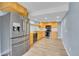 Well-lit kitchen features stainless steel appliances, wood cabinets, and sleek countertops for a modern cooking experience at 12651 Elm St, Thornton, CO 80241
