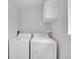 Functional laundry room featuring a washer and dryer, with efficient layout to maximize space and convenience at 12651 Elm St, Thornton, CO 80241