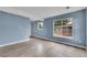 Inviting living room with hardwood floors, large windows and neutral paint at 12651 Elm St, Thornton, CO 80241