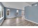Bright living room featuring large windows, hardwood floors and french doors at 12651 Elm St, Thornton, CO 80241