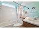 Aqua bathroom with a shower/tub combo, toilet and vanity with sink at 4175 S Andes St, Aurora, CO 80013
