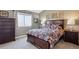 Bedroom with decorative bedding, a dresser, and neutral tones for a calming retreat at 4175 S Andes St, Aurora, CO 80013