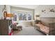 Cozy bedroom with crib, chair and large window providing great natural light at 4175 S Andes St, Aurora, CO 80013