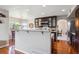 Bright kitchen with an island, stainless steel appliances, and wood flooring at 4175 S Andes St, Aurora, CO 80013