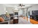 Inviting living room with fireplace, comfortable seating, and sliding glass doors to the yard at 4175 S Andes St, Aurora, CO 80013
