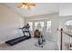 Spacious loft with workout equipment, bright windows, and views of the neighborhood at 4175 S Andes St, Aurora, CO 80013