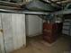 Unfinished basement with exposed ductwork and an old furnace at 1346 S Logan St, Denver, CO 80210