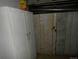 Unfinished basement featuring white cabinets and exposed utilities at 1346 S Logan St, Denver, CO 80210