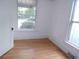 Bedroom with hardwood floors and white walls offers plenty of natural light at 1346 S Logan St, Denver, CO 80210