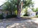 Street view of a home surrounded by a well-kept brick garden at 1346 S Logan St, Denver, CO 80210