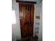 Intricately designed wood door with shelves and a small window at 1346 S Logan St, Denver, CO 80210