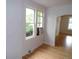 Bright living room featuring hardwood floors, white walls, and natural light at 1346 S Logan St, Denver, CO 80210