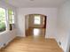 Bright and airy living room featuring gleaming hardwood floors and lots of windows at 1346 S Logan St, Denver, CO 80210