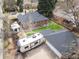 A bird's-eye view highlights the RV parking, brick home, detached garage, and neatly landscaped yard of this property at 795 N Jersey St, Denver, CO 80220